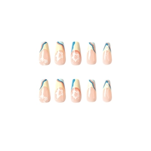 Press-on nails with peach base featuring blue yellow French tips and white floral patterns
