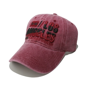 Detail of Los Angeles 3D embroidery on vintage washed cotton baseball cap in burgundy