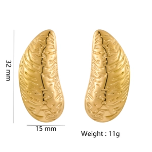 Detail view of gold textured bow earrings showing 32mm height and 15mm width dimensions