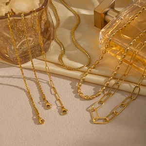 Minimalist gold link necklace set featuring snake, bead, and curb chains for women