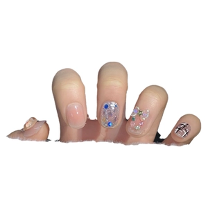 Handmade Christmas bear press-on nails with pink blush gradient and 3D resin bows