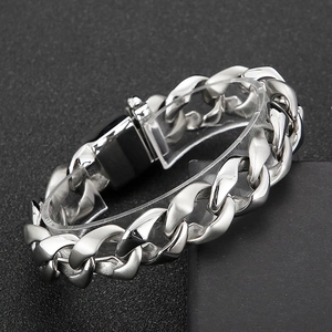 Rugged silver steel Cuban link chain bracelet for men with heavy metal texture and clasp