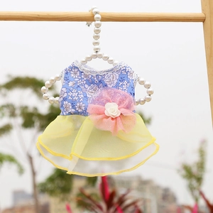 Floral pet dress with yellow mesh tutu and 3D pink flower detail on a pearl hanger