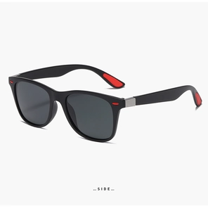 Detailed side view of sport sunglasses with black matte frame and red anti-slip pads