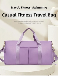 Detail of purple waterproof travel duffel with dual handles and front pockets for fitness