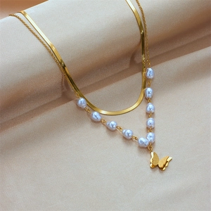 Double-layer gold snake chain necklace with white pearls and a frosted butterfly pendant