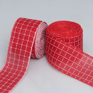 Detail of red and white checkered burlap ribbons for festive Christmas gift wrapping