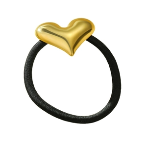 Minimalist black elastic hair tie featuring a polished gold heart-shaped accent piece