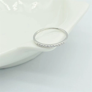 Elegant S925 sterling silver toe ring with white zircon diamonds on a ceramic surface