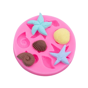Pink silicone mold for seashell and starfish cake decorations and chocolate baking tools