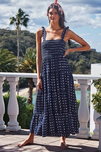 Detail of adjustable tie straps and smocked bodice on blue tiered summer dress