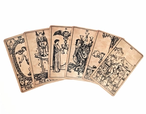Detail showing fan-shaped arrangement of vintage Oracle cards with aged brown texture