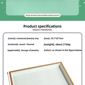 Macro view of rosewood jewelry display tray with green velvet lining and dimensions