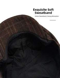 Detail view of the soft cotton sweatband inside the brown plaid wool newsboy cap