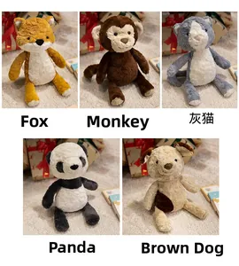 Macro detail of plush animal toy collection showing textured curly fur and stitched features
