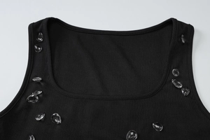 Close-up of black ribbed tank top neckline with transparent teardrop bead embellishments