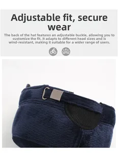 Detail of adjustable metal buckle on dark blue winter hat for secure windproof fit