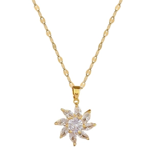 Titanium steel gold necklace with sparkling starburst pendant and micro-set crystals