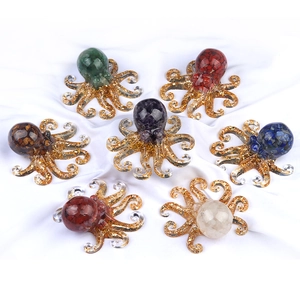 Set of seven crystal resin octopus figurines with colorful gemstones and gold leaf accents