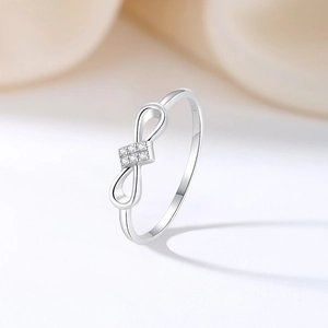 Elegant S925 sterling silver infinity ring with sparkling pavé cubic zirconia accents