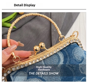 Detail of blue denim evening bag with golden spiral handle and sparkling crystal trim