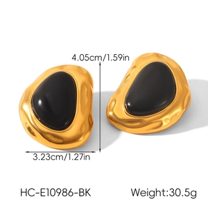 Detailed view of gold irregular earrings with black resin inlay and precise dimensions