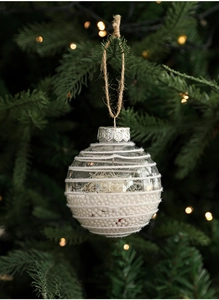 Detail of 8cm transparent Christmas ball with white foam filling and twine on a tree