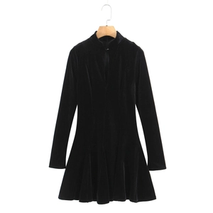 Slim fit black velvet mini dress with long sleeves and elegant V-neckline on white background