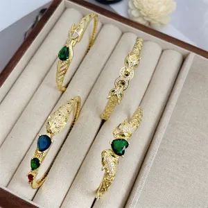 Panther head bangles with 18K gold plating, pavé cubic zirconia and colorful gemstones