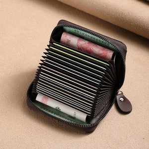 Brown frosted leather accordion card holder with 11 slots and secure metal zipper