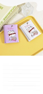 Detailed view of purple and white cartoon cat wallets with card slots and bill pocket