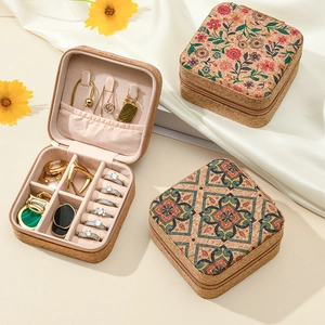 Floral and geometric cork jewelry box for travel with pink velvet lining and ring slots