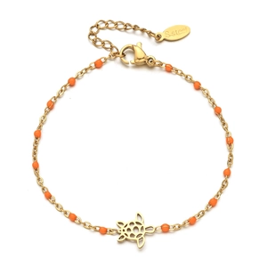 Detail of gold-plated stainless steel turtle bracelet with orange beads and lobster clasp
