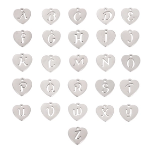 Macro view of 26 heart-shaped stainless steel alphabet charms for DIY jewelry