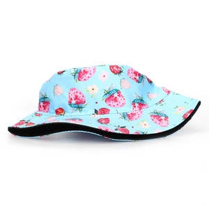 Close-up of strawberry digital print on blue bucket hat with black lining