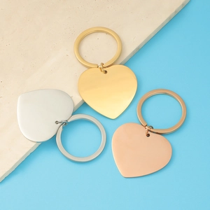 Polished heart keychains in silver, gold, and rose gold with mirrored stainless steel finish