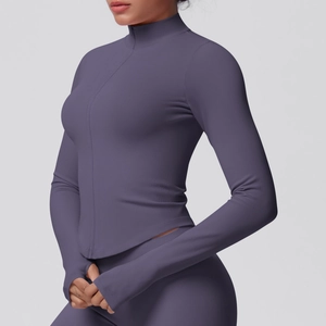Detail of ribbed knit fabric on high-neck zipper sports jacket with thumbhole cuffs