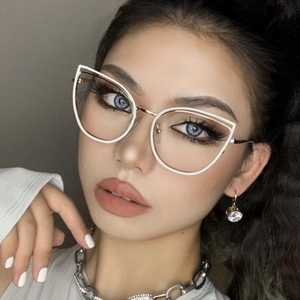 Close-up of model wearing white cat-eye metal glasses frames with gold accents