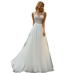 Elegant white A-line wedding dress with lace illusion neckline and layered tulle skirt