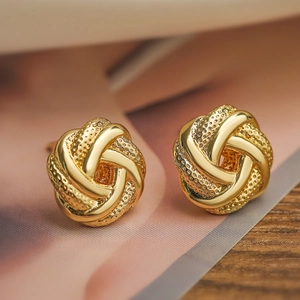 Mini 18K gold plated copper flower stud earrings with a textured twisted knot design