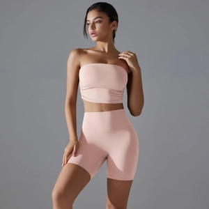Detail of high-waist yoga shorts in dusty rose with contouring side seams for lifting
