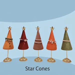 Five velvet star cone jewelry display stands in assorted colors with gold metal bases
