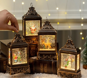 Close-up of vintage bronze Christmas lanterns with warm light on antique books