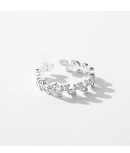 Macro shot of silver olive leaf open ring with sparkling cubic zirconia inlay detail
