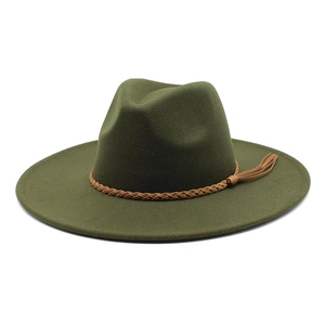 Detail of dark green wool fedora hat featuring a brown braided leather band and tassels