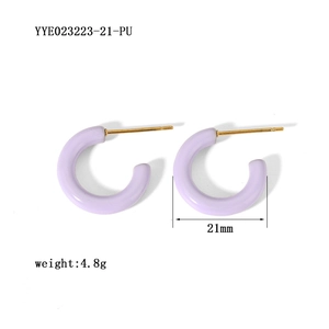 Detailed view of 21mm purple enamel C-shaped hoop earrings with gold posts