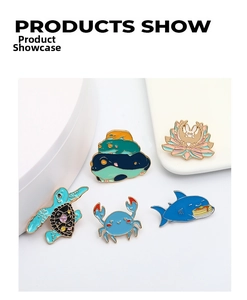 Detailed view of 5 cute enamel pins set featuring a shark, crab, turtle, and frog