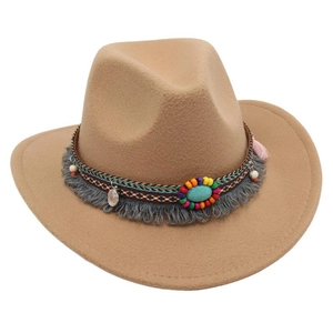 Detail of camel wool felt fedora featuring bohemian tassels and turquoise stone
