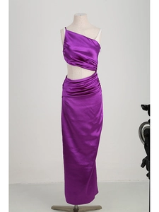Detail of purple satin one-shoulder dress with side cutout and elegant ruched texture