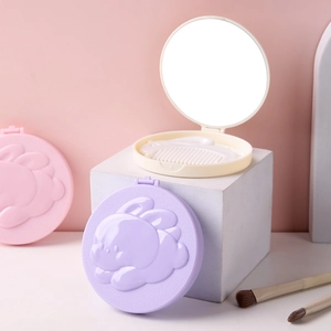 Portable folding cartoon mirror and comb set with 3D bunny relief in pastel colors